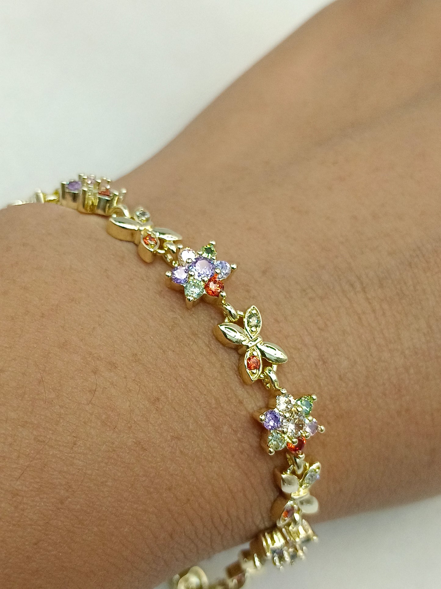 Pulsera flor con mariposa